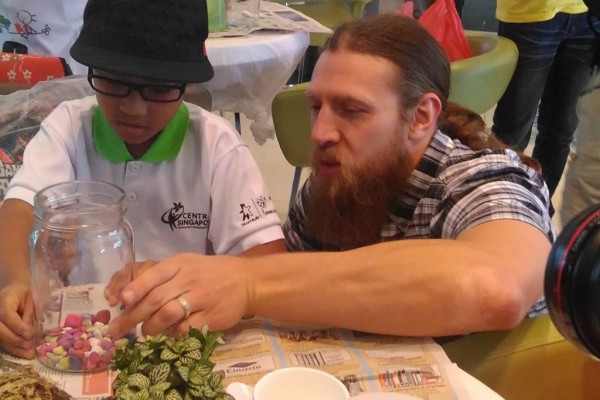  WWE Superstar Daniel Bryan Teaches Gardening To Singaporean Children