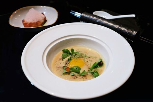 Elevated fish congee with sea bass and ginger espuma 